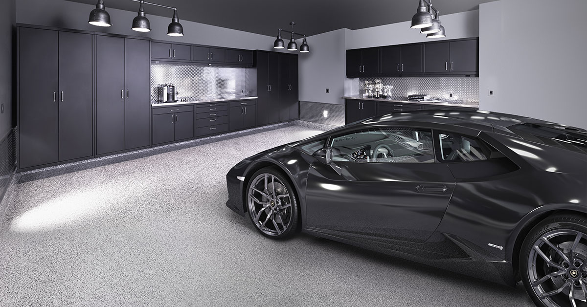 Black matte GL Custom Steel cabinetry, a Floortex™ floor coating (Charcoal), and a 2016 Lamborghini Huracán Spyder.