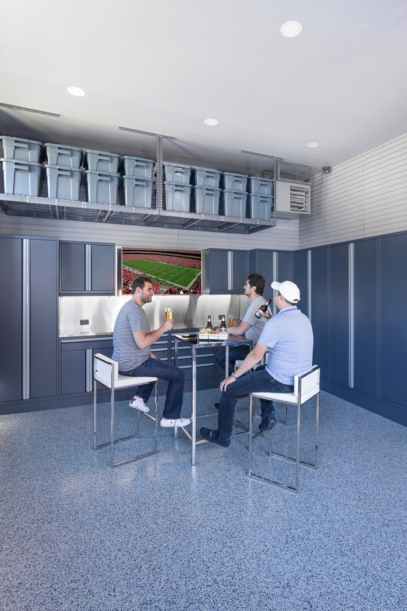 Harbor design garage featuring men watching football game