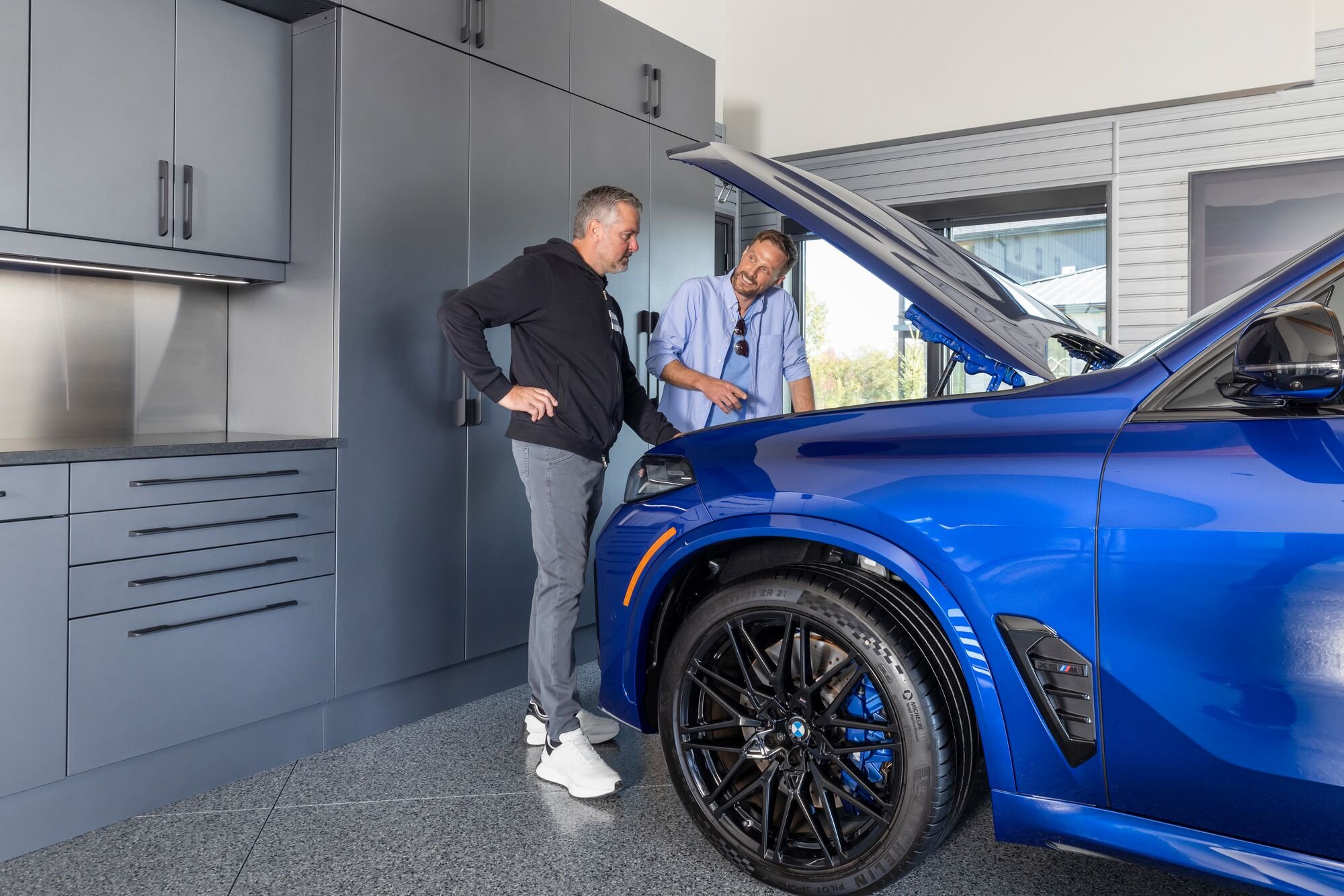 Checking the car in the garage by Garage Living