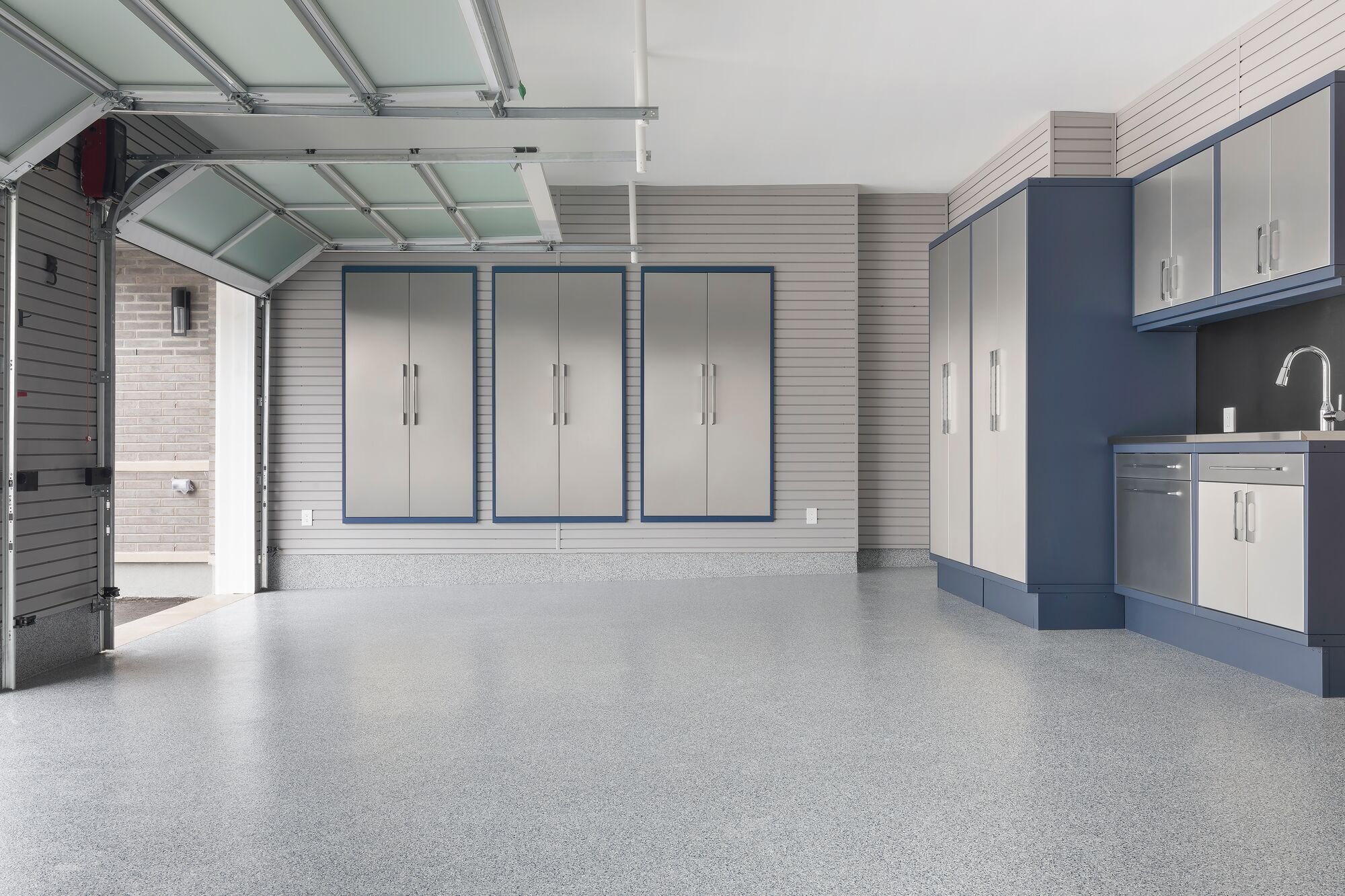 Luxury Garage with car by Garage Living