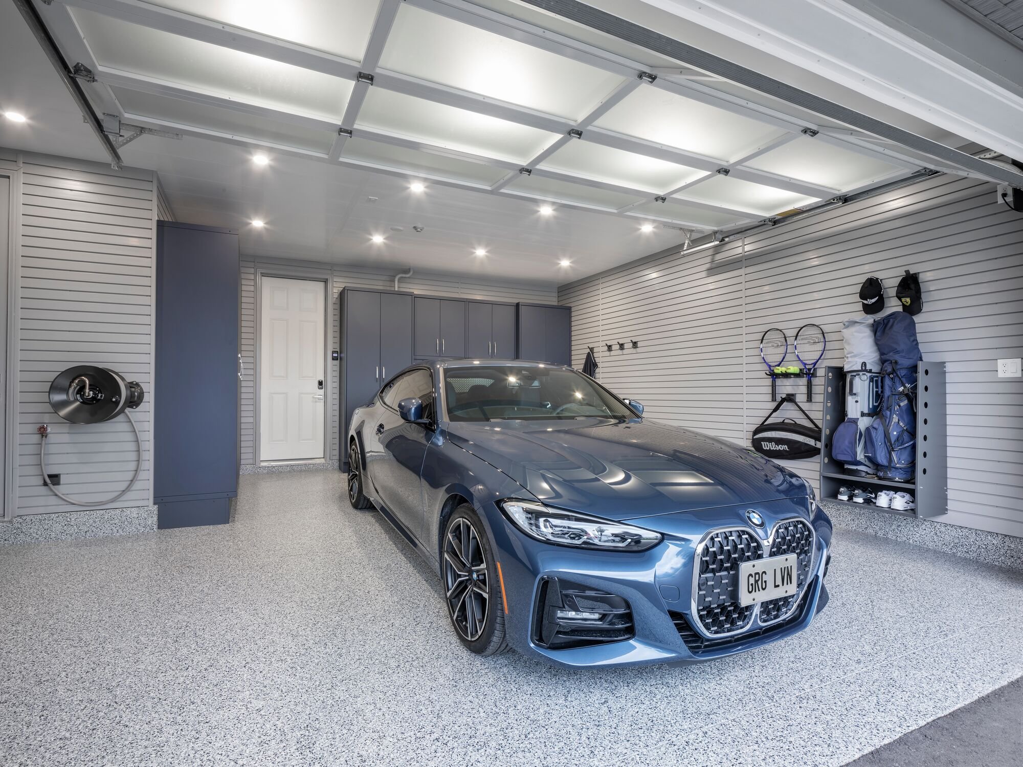 Garage Living Garage with BMW and LINEA Golf Caddy With Shoe Shelf