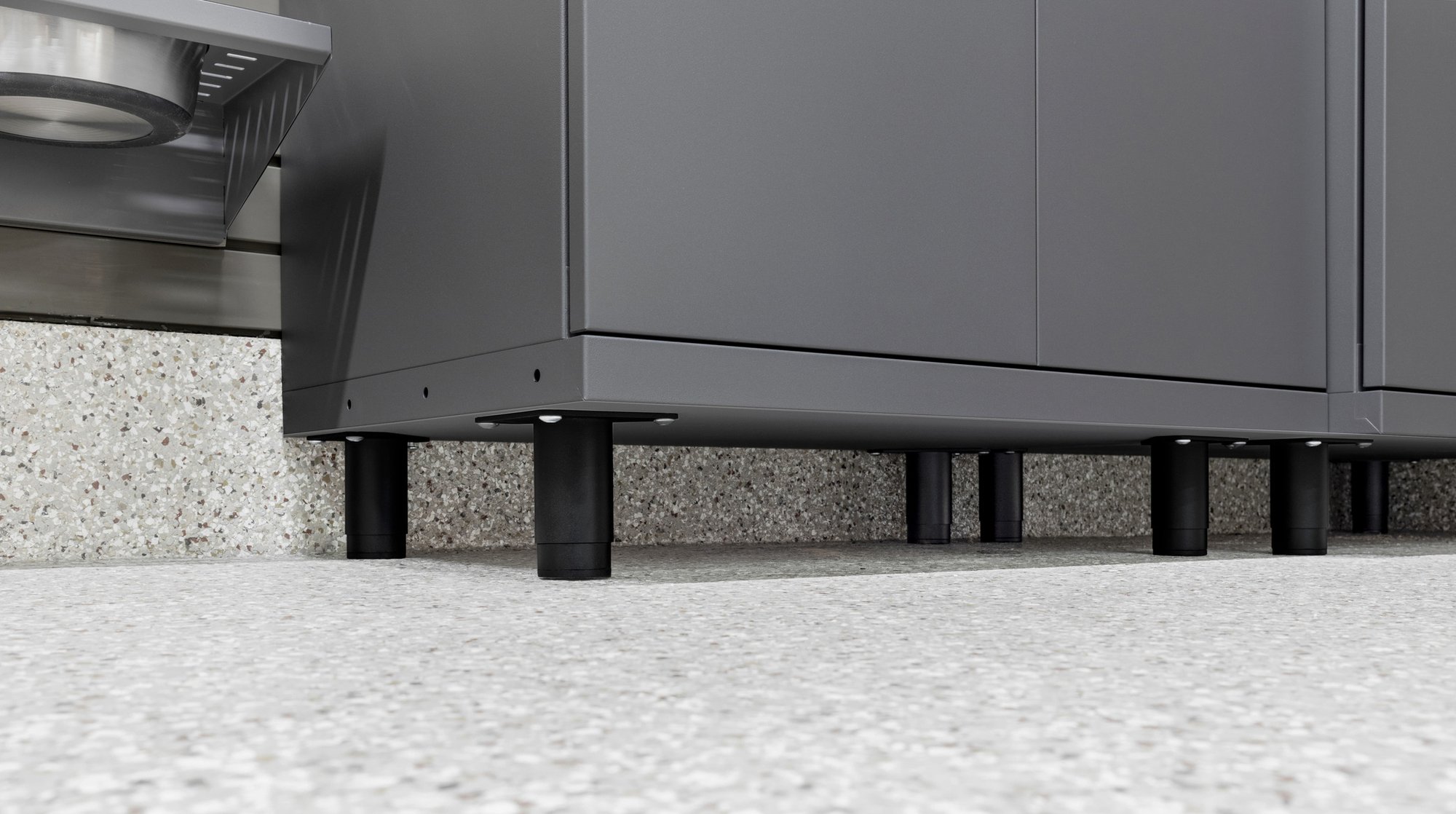 Adjustable leveling legs with nylon pads by Garage Living