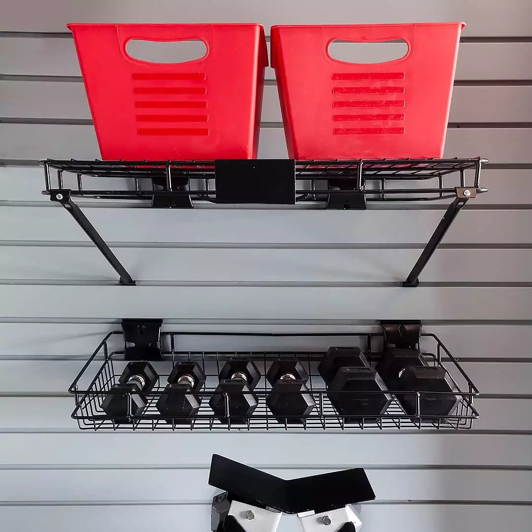 slatwall system support with dumbbells - The Fitness Room Garage - Garage Living