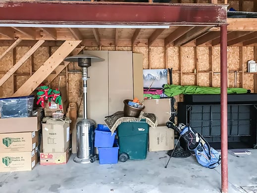 Cluttered garage transformation before Garage Living