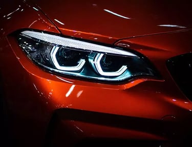 Performance Designer Series Inspiration - headlight of red car - Garage Living